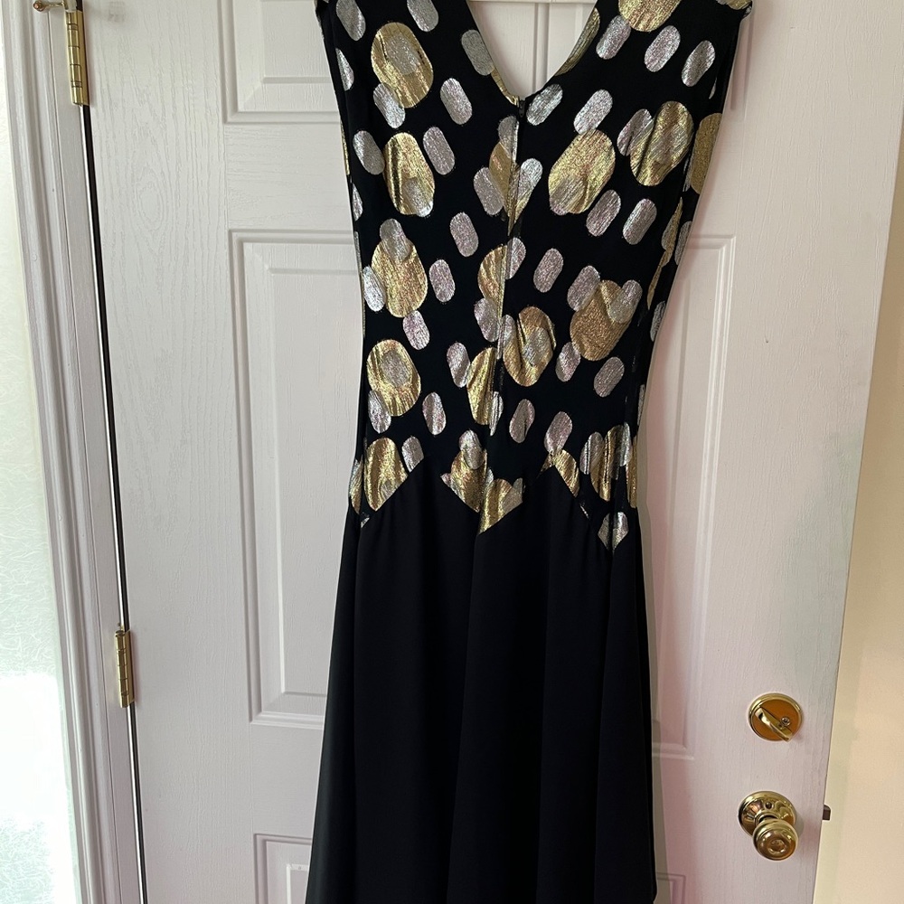 Evening dress,falls below the calf.